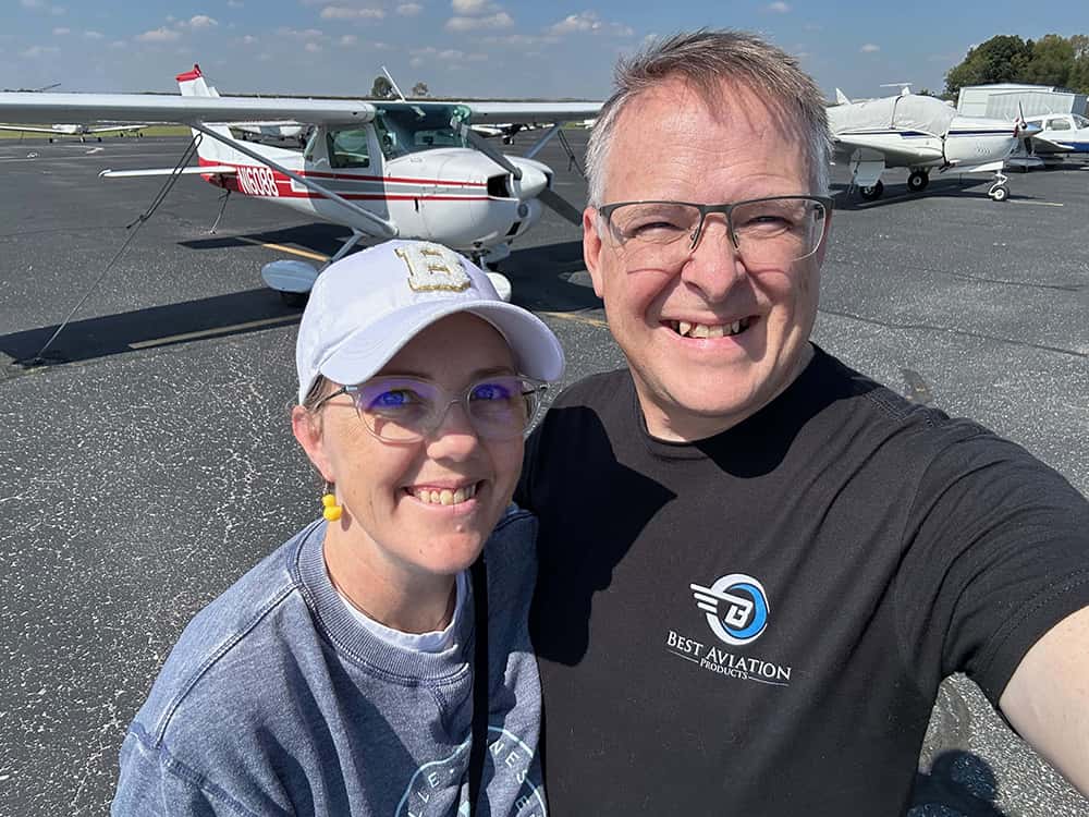Evan and his wife with their Cessna 150